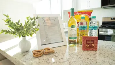 a counter top with a bottle of wine and a vase at Luxurious 3-Bedroom Retreat in Santiago de los Caballeros in Santiago de los Caballeros