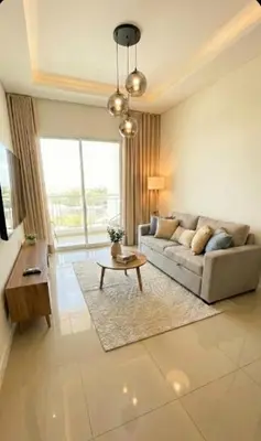 a living room with a couch and a table at Apartamento paseo del bosque in Santo Domingo