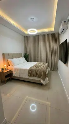 a bedroom with a bed and a television in it at Apartamento paseo del bosque in Santo Domingo