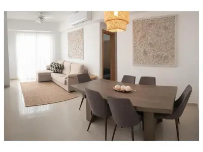 a dining room with a table and chairs at Apartement cosy et lumineux in Cuevas