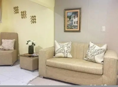 a living room with a couch and a table at Aparta estudio Lomar II in Puerto Plata