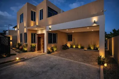 a large house with a driveway in front of it at Private residential vacation home in Cabarete in Cruce de Veragua
