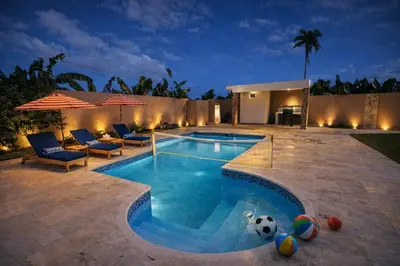 a swimming pool with a soccer ball in the middle at Private residential vacation home in Cabarete in Cruce de Veragua