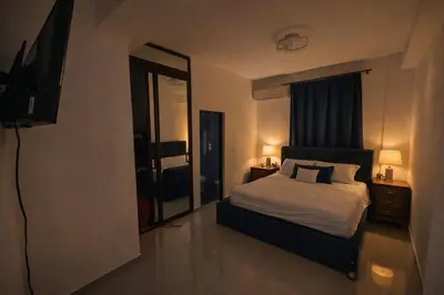 a bedroom with a bed and a television in it at Private residential vacation home in Cabarete in Cruce de Veragua