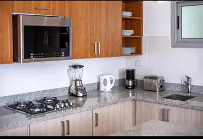 a kitchen with a counter top with a blender at Imperial Suite 1-bedroom ocean view and kitchen in Cabarete
