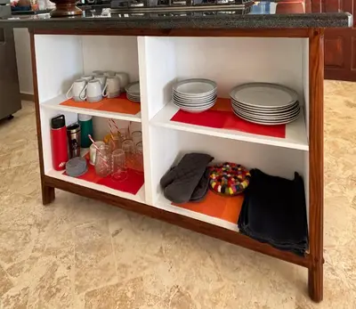 a kitchen cabinet with plates and dishes on it at Villa Aurora Samaná in Santa Bárbara de Samaná