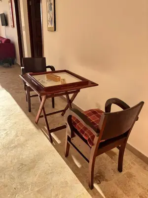a coffee table and a chair and a table and a table at Villa Aurora Samaná in Santa Bárbara de Samaná