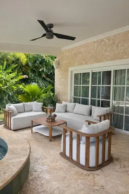 a living room with couches and a table at Villa Wolf in Punta Cana