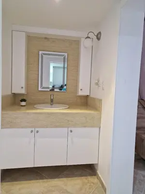 a bathroom with a white sink and a mirror at Big & classy condo at Cocotal Golf & Beach in Punta Cana