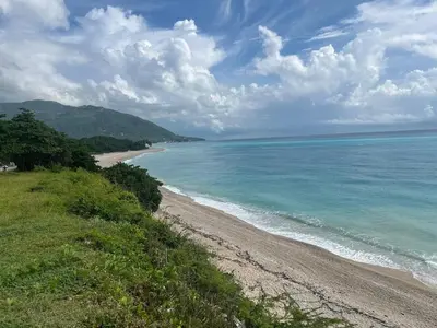 a view of the beach from a hill at 2 Bdrm 1 Bath Near River and Beach, 3L, Paraiso, Barahona in Paraíso