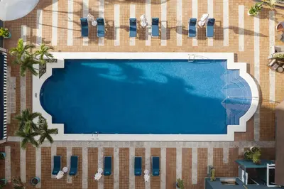 an overhead view of a swimming pool in a resort at Catalonia Santo Domingo in Santo Domingo