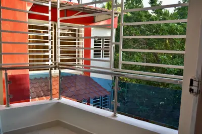a room with a window with a view of a table at Hotel la playa in Santa Cruz de Barahona