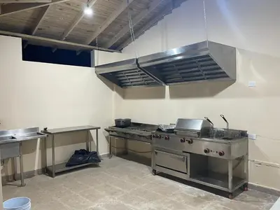 a kitchen with a stove and a sink at Villa A&J in Santa Cruz de Barahona