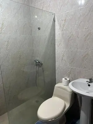 a bathroom with a shower and a toilet and a sink at Comodidad, descanso y una vista que inspira in Miches