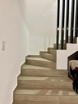 a staircase in a house with wooden flooring at Laggo one houses in Punta Cana