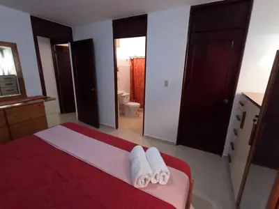 a bedroom with a bed with towels on it at Charming 2-Bedroom Apartment with Stunning Views in Santiago in Santiago de los Caballeros