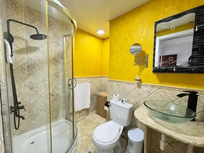 a bathroom with a sink and a toilet and a shower at Dreamvillage in Boca Chica