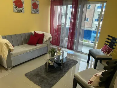 a living room with a couch and a table at Garden view paradise in Concepción de La Vega