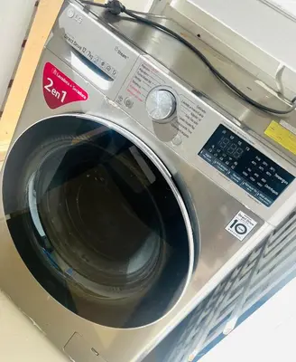 a silver washing machine sitting on top of a counter at Residencial Larimar 1 - Steps from Bayahíbe Beach in Bayahibe