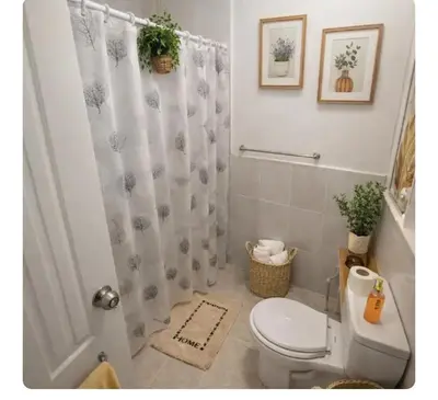 a bathroom with a toilet and a shower curtain at Apartamento cerca del aeropuerto y la playa in San Isidro