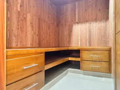 a closet with wooden walls and wooden cabinets at Enjoy Huge 4 bedrooms, and 3 bathrooms, 8 new apartments in Santiago de los Caballeros