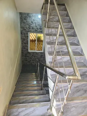 a staircase in a house with a stone wall at Apartahotel Henry Winche in Sabana Grande de Boyá
