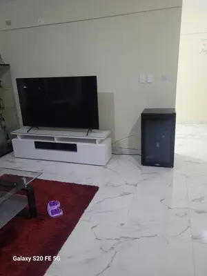 a living room with a flat screen tv on a wall at bienvenido a casa in San Pedro de Macorís