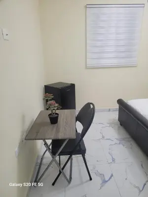 a table and a chair in a room at bienvenido a casa in San Pedro de Macorís