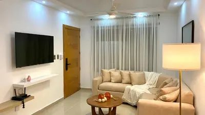 a living room with a couch and a table at Apartamento San Pedro Colonial in San Pedro de Macorís
