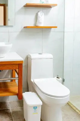 a bathroom with a white toilet and a sink at Hotel Stars Bávaro hab 102 in Punta Cana