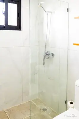 a shower with a glass door in a bathroom at Hotel Stars Bávaro hab 102 in Punta Cana