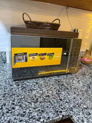a box on top of a microwave on a counter at Beautifull and Luxe Apartment 10 mn to the Int Airport in Los Paredones