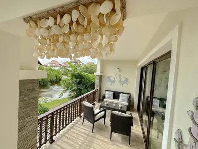 a room with a balcony with a chandelier at Portillo Residences, El Limon, Luxury Apartment in El Limón