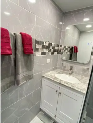 a bathroom with a sink and a mirror at Crystal Pool Oasis in Sosúa