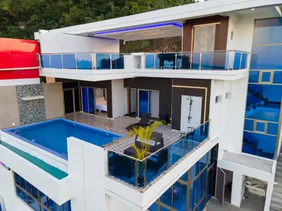 an aerial view of a building with a swimming pool at Villas Escape in Las Terrenas