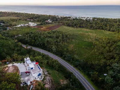 an aerial view of a house on a hill next to a road at Villas Escape in Las Terrenas