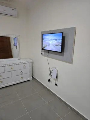 a room with a flat screen tv on a wall at Luxury Apartment in Boca Chica in La Julia