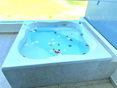 a blue bath tub filled with lots of debris at New Jacuzzi Beach Fun 2 bedroom at Cana Rock Star in Punta Cana