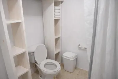 a small bathroom with a toilet and a shower at Villa La Olita in La Puntica de Juan Dolio