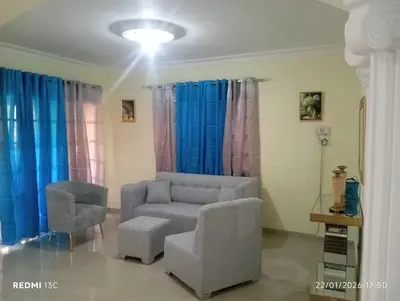 a living room with a couch and a chair at Casa vacanza, Mendosa in Bayaguana