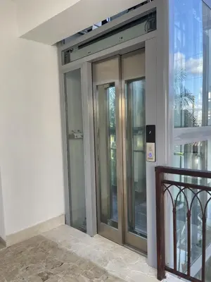 an entrance to a building with glass doors at Mila Apartment in Bayahibe