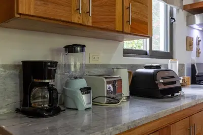 a kitchen counter with a blender and a toaster at Pro Cab Apartment - Washer - BBQ in Cabarete
