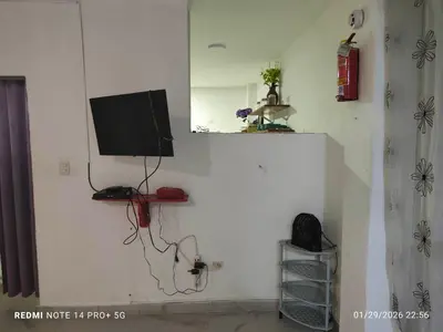 a living room with a tv on a wall at housing Freddy in Santo Domingo