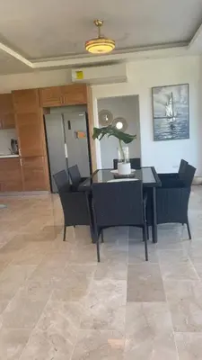 a dining room with a table and chairs at Spacious 3-Bedroom Apartment with Pool Access in Juan Dolio in Juan Dolio