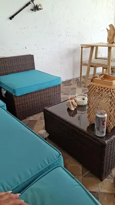a living room with two chairs and a table at Villa Manuel Rodriguez