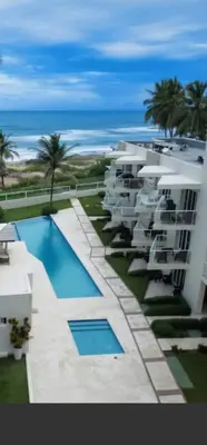 a view of a resort with a swimming pool and the ocean at Cristamar in Cabarete