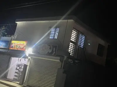 a building with a light on the side of it at night at apartamiento reyes in Pantoja