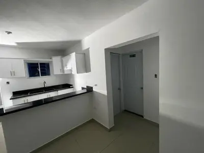 a white kitchen with a sink and a counter at apartamiento reyes in Pantoja