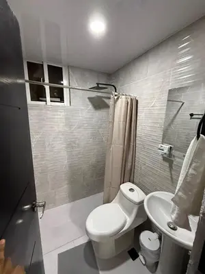 a bathroom with a toilet and a sink at Moon Apartamentos C4 in San Cristóbal