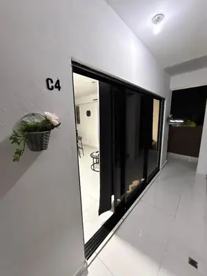 a room with a window and a plant on the wall at Moon Apartamentos C4 in San Cristóbal